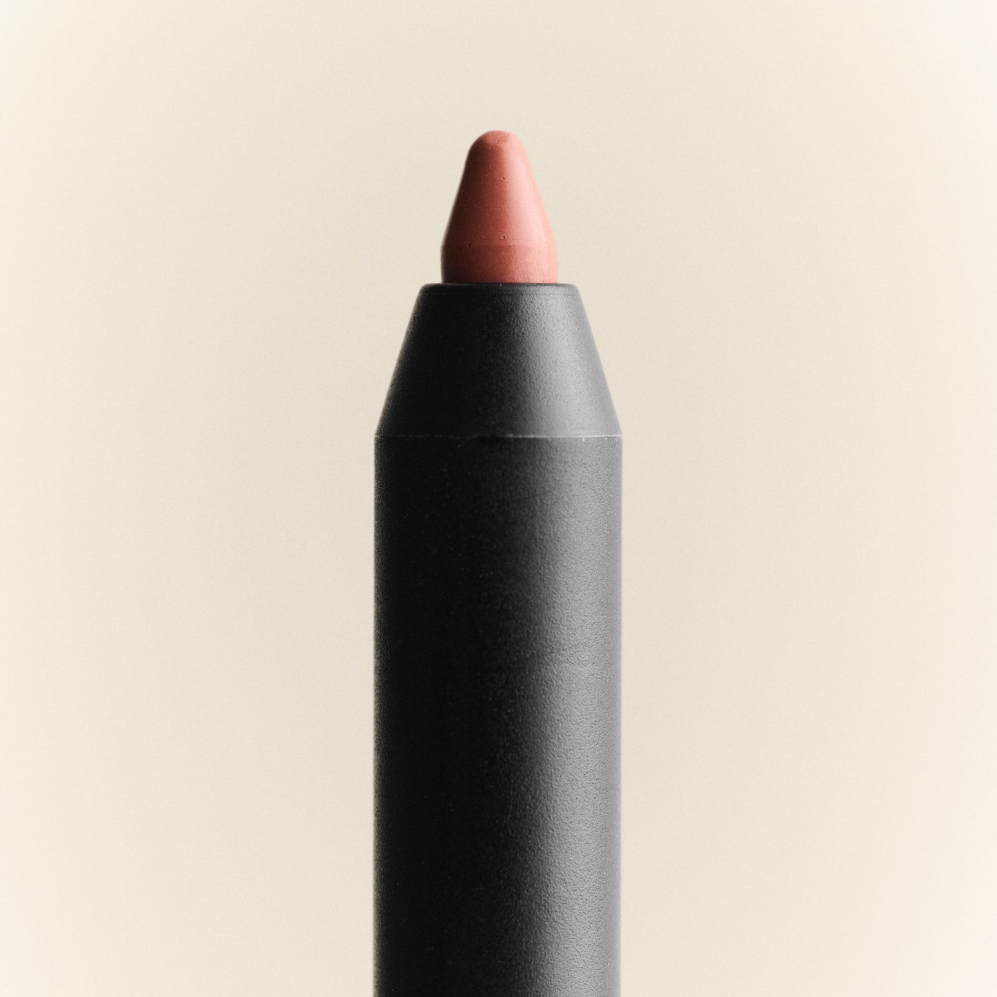 Lip crayon with a beige color on a beige background