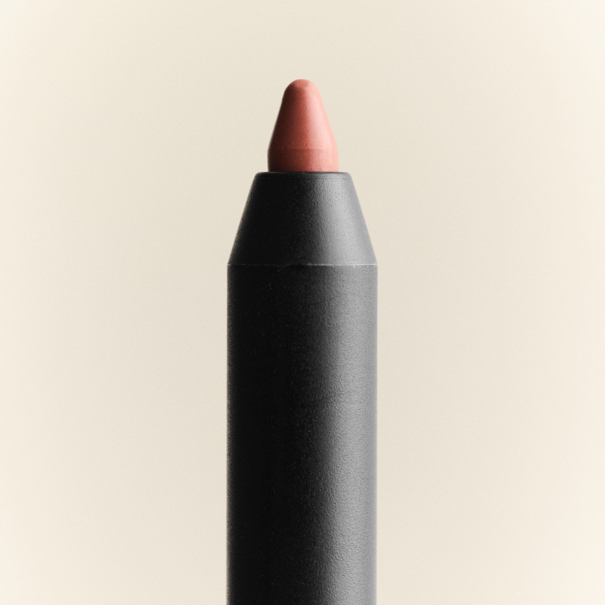 Lip crayon with a beige color on a beige background